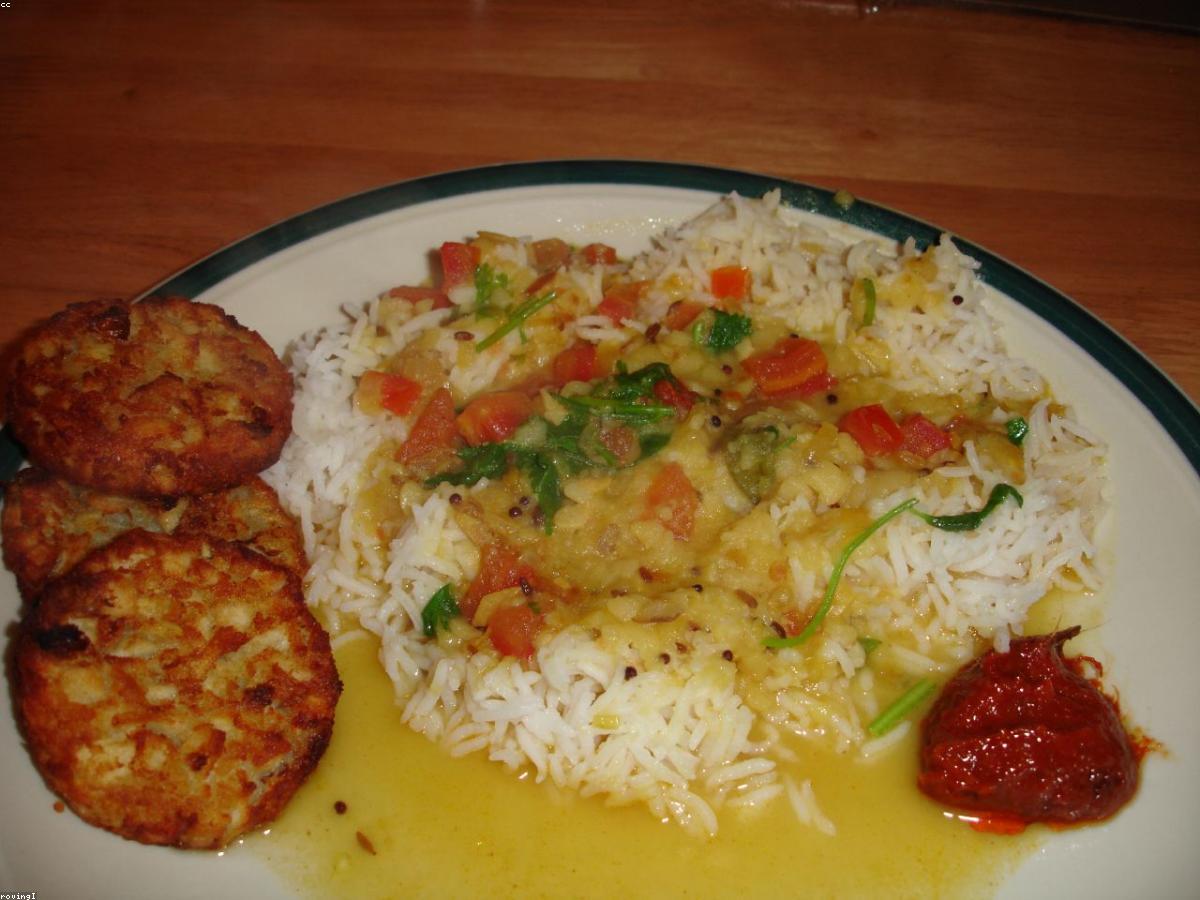 A variety of home-style Pakistani dishes laid out for the week — daal, chicken curry, rice, and roti